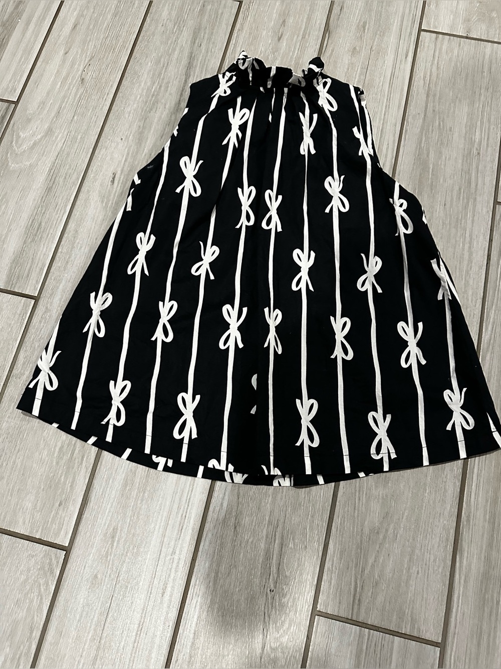 Umgee Black A-Line Sleeveless Blouse with White Bow-Stripe Print